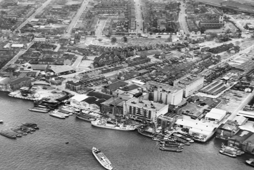 Bermondsey Wall West, Chambers Wharf (centre), Old justice pub (to the left) East Lane(right) and St James Church in the distance, c1951.  2 X..png