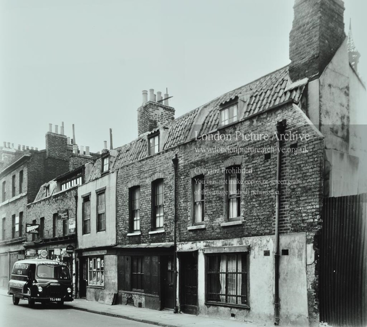 Snowsfields, Nos 74-77, the sign on the van reads Teeigen's Tea.  X..jpg