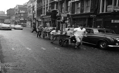 2 Borough Market Workers Fruit Barrow Race, 1966. Borough High Street, looking towards London Bridge. X..png