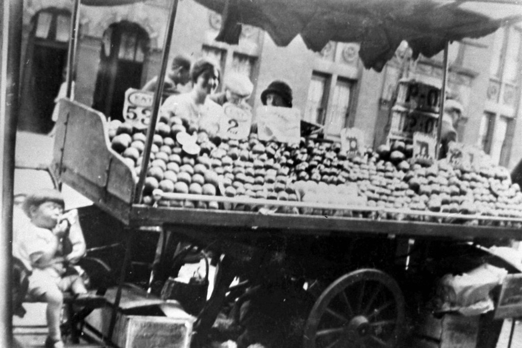 Tower Bridge Road, the little lad on the chair is Charlie Pauly and his mum Mary Groger with her barrow on Tower Bridge Road,c1928.  X..jpg