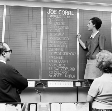 Pat Aiken, 21, of Bermondsey chalks up the odds of the 1966 World Cup, at the head offices of Joe Coral in Regent Street..jpg