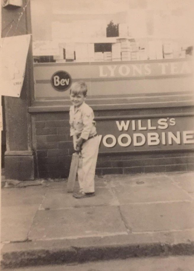 Stalham  Street, Bermondsey , Mick Perkins outside is nans sweet shop, mid 1950s.  X..jpg