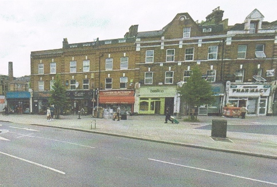 7. Tower Bridge Road,c1922, Tower Electrics is the orange shop. Hartley’s chimney to the left, Green Shop (Basilico) was where Edwards Donoughts was.  X.jpg