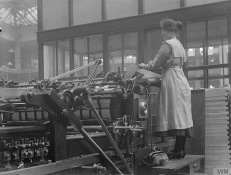 Stamford Street c1918. W H Smith & Sons, a female worker operating a laying machine in the printing works.  X..png