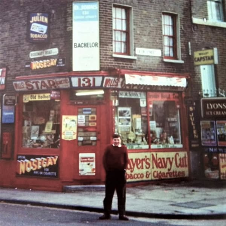 Cator Street, corner with Rosemary Road, Dai Johns' newsagents, and later general store,   Bill Johns, son of the owner.  X..png