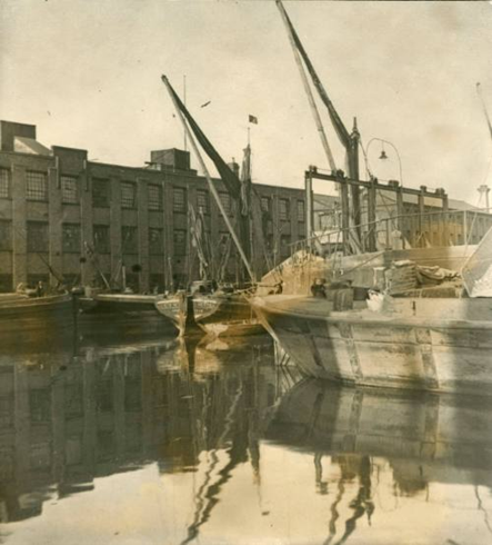 Surrey Canal showing the Edison Bell Buildings and barges, c1920 off Glengall Road. X..png