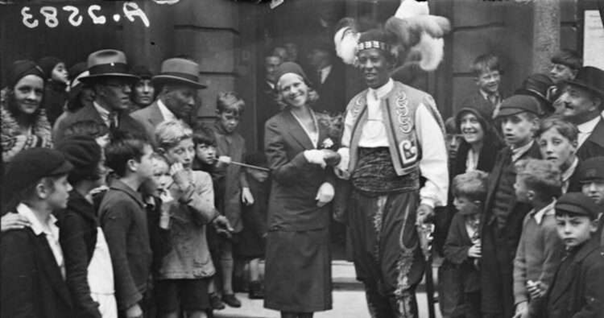 East Street, Prince Monolulu,  26 October 1881 – 14 February 1965, with his bride..png