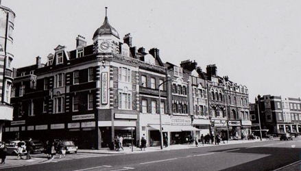 Walworth Road corner with  Merrow Street left, Harvey and Thompson, with its three brass balls beneath the clock tower.  X..png