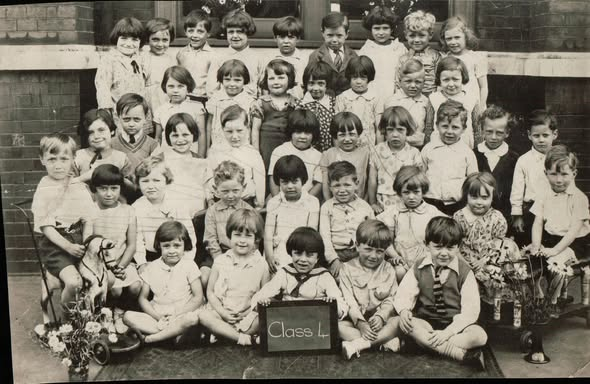 Larcom Street, St Johns School, Ronald Hines actor, sitting front row on the right with his tie hanging out.   Mid-1930s.  X..png