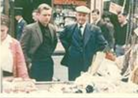 11. East Street 1966, Ted Walker, wife Alice  and Son working on his Haberdashery stall outside Zack's.  X.png